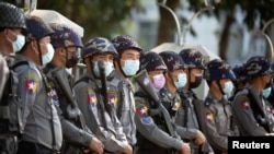 Police stand guard as they wait for protests against coup in Yangon, Myanmar, Feb. 4, 2021. 