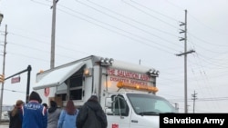 The Salvation Army hands out hot meals in Chicago.