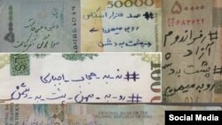 Indigenous Anangu children play with a camera during a ceremony marking the permanent ban on climbing Uluru, also known as Ayers Rock, at Uluru-Kata Tjuta National Park in Australia's Northern Territory.
