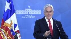 Chilean President Sebastian Pinera speaks to the nation in Santiago, Oct. 22, 2019, on a fifth straight day of protests against a now suspended hike in metro ticket prices.