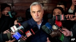 Calin Georgescu, independent candidate in the presidential elections, speaks to media, in Izvorani, Romania, Nov. 26, 2024.