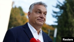 FILE - Hungarian Prime Minister Viktor Orban talks to the media in Budapest, Hungary, Oct. 13, 2019. 