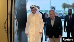 Qatari Prime Minister Sheikh Mohammed bin Abdulrahman bin Jassim Al Thani walks with United Nations Secretary-General Antonio Guterres during their meeting in Doha, Qatar, on Oct. 28, 2023. (Qatar News Agency via Reuters)