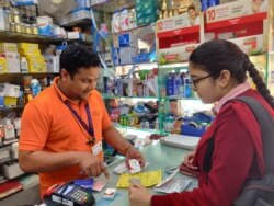 A young man buys medication at a pharmacy in New Delhi, March 6, 2020. (A. Pasricha/VOA). India is one of the world's major producers of affordable drugs.