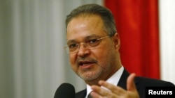 FILE - Yemeni Foreign Minister Abdel-Malek al-Mekhlafi speaks to the media after the Yemen peace talks in Switzerland in Bern, Dec. 20, 2015