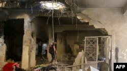 A man inspects the damage in a house that was hit in an Israeli airstrike in the eastern Lebanese city of Baalbek in the Bekaa valley on Oct. 21, 2024.