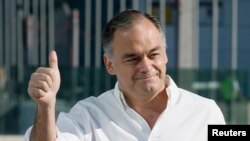 FILE - Esteban Gonzalez Pons gestures during his arrival on the last day of the Popular Party's 16th National Congress in Valencia, June 22, 2008. 