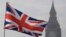A Union flag flies in front of the Big Ben clock tower in London, Britain, Jan. 23, 2017. 