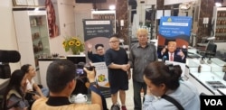 “Trump” and “Kim” meet the press inside the Tuan Duong Hair Salon in Hanoi, Feb. 19, 2019. (Photo - courtesy Tuan Duong)