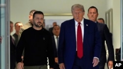 FILE - Donald Trump, then the Republicans' 2024 presidential nominee, is pictured with Ukraine's President Volodymyr Zelenskyy at Trump Tower, Sept. 27, 2024, in New York. 