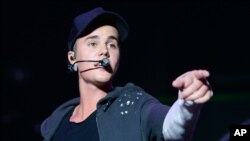 Recording artist Justin Bieber performs at the 2015 Billboard Hot 100 Music Festival at Nikon at Jones Beach Theater in Wantagh, NY.