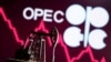 Ilustrasi yang menggambarkan pompa angguk di depan logo OPEC. (Foto: Reuters)