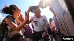 Demonstrators argue with police during a protest against a NATO summit in Brussels, Belgium, May 25, 2017. 