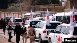International Committee of the Red Cross (ICRC) convoy seen crossing into eastern Ghouta near Wafideen camp in Damascus, March 5, 2018. 