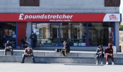 People practice social distancing in Woolwich as the spread of the coronavirus disease continues, in London, April 4, 2020.