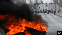 Demonstrators block a highway to protest Peruvian President Dina Boluarte's government and Congress in Arequipa, Peru, Jan. 19, 2023. 