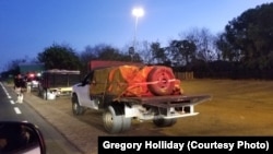 Trucks carrying medicine, rice and powdered milk, part of a combined shipment of U.S. and Brazilian aid, head from Boa Vista, Brazil, into southern Venezuela, Feb 23, 2019. (Courtesy - Gregory Holliday)