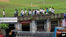 FILE - Members of the Muslim organization Popular Front of India (PFI) undergo parade training at a football ground in Kottayam, southern Kerala state, India, June 27, 2010.