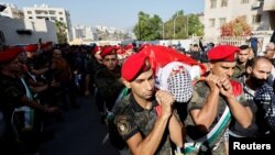 Mourners attend the funeral of Palestinian Ramzi Zabara, who was killed by Israeli forces, in Nablus, in the Israeli-occupied West Bank, Oct. 28, 2022.