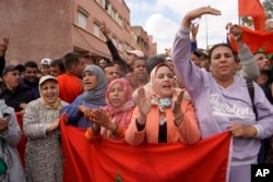FILE - People displaced by the earthquake protest against lack of emergency assistance and worsening housing conditions in Amizmiz, outside Marrakech, Morocco, on Oct. 24, 2023.