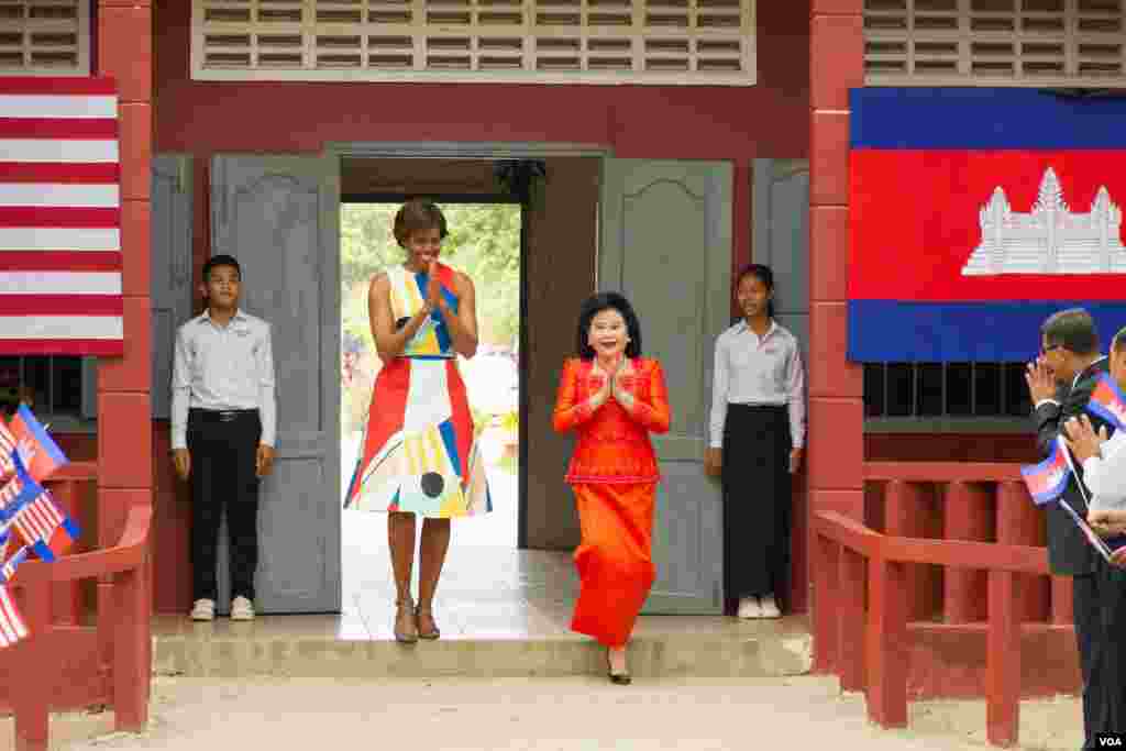 Michelle Obama arrived with her Cambodian counterpart, Bun Rany, at Hun Sen Prasat Bakong Hight School, outside Siem Reap, March 21, 2015.