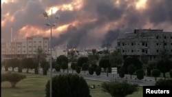 Smoke is seen following a fire at an Aramco factory in Abqaiq, Saudi Arabia, Sept. 14, 2019, in this picture obtained from social media.