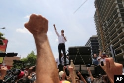 Opposition leader Juan Guaido speaks to supporters in Caracas, Venezuela, May 1, 2019.