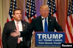 FILE - Republican U.S. presidential candidate Donald Trump, with former rival candidate Governor Chris Christie, left, at his side, speaks at a news conference in Palm Beach, Fla., March 1, 2016.