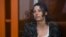 FILE - U.S.-Russian national Ksenia Karelina, also known as Ksenia Khavana, sits in a glass cage in a court room in Yekaterinburg, Russia, June 20, 2024. 