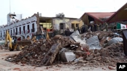 Pro-democracy demonstrators face water canons as police try to clear the protest venue in Bangkok, Thailand.