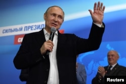 FILE - Russian President and Presidential candidate Vladimir Putin speaks during a meeting with supporters at his campaign headquarters in Moscow, Russia March 18, 2018.
