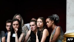 Swedish climate activist Greta Thunberg (2nd-R) attends a session of questions to the government at the French National Assembly in Paris after an earlier speech.