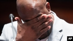 Philonise Floyd reacts as he describes the pain of losing his brother George as he testifies during a House Judiciary Committee hearing on proposed changes to police practices and accountability on Capitol Hill, June 10, 2020, in Washington.