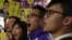 FILE - Alvin Yeung (2nd R), a candidate from Civic Party, chants slogans with supporters at a campaign rally during a legislative by-election in Hong Kong, China.