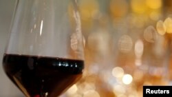 A glass of French red wine is displayed at the Chateau du Pavillon in Sainte-Croix-Du-Mont, France, July 29, 2019. 