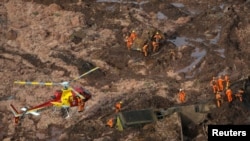 Rescue crew work in a tailings dam owned by Brazilian miner Vale SA that burst, in Brumadinho, Brazil, Jan. 25, 2019. 