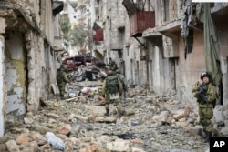 FILE - This undated handout photo released, Jan. 2, 2017, by the Russian Defense Ministry claims to show Russian Military engineers operating in Aleppo, Syria.