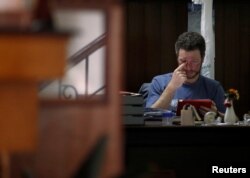 Australian climber Robert Gropel, husband of Maria Strydom, 34, who died while descending from the summit of Mount Everest, sits inside his hotel after being rescued from Everest in Kathmandu, Nepal, May 24, 2016.
