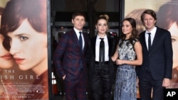 FILE - From left, Eddie Redmayne, Amber Heard, Alicia Vikander and Tom Hooper arrive at the premiere of "The Danish Girl" at Regency Village Theatre, Nov. 21, 2015, in Los Angeles, California.