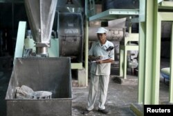 Thongdee Saenghow, a 62-year-old production supervisor, works at a rice vermicelli factory outside Bangkok, Thailand, Feb. 5, 2016.
