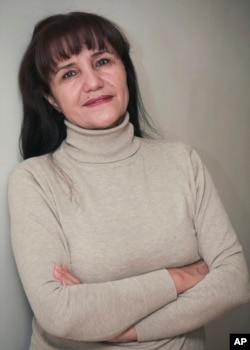 FILE - Uzbek film director Umida Akhmedova, pictured in Tashkent in November 2009, has been accused of slander and "damaging the country's image" for publishing a series of photos about life in rural parts of Uzbekistan.