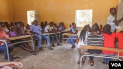 Isidore Tine (right) teaches the English Club of Fandene, Senegal.