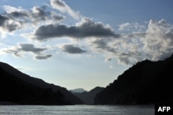 FILE - The sun sets over the Mekong river Oct., 16, 2009, near Pak Beng in northern Laos near the Thai border.