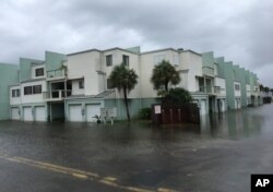 Floodwaters surround a condo in the aftermath of Tropical Storm Nate in Pensacola Beach, Florida, Oct. 8, 2017.