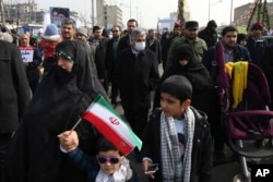Commander of Iran's Revolutionary Guard Gen. Mohammad Ali Jafari, center, attends an annual rally commemorating the anniversary of the 1979 Islamic revolution, which toppled the late pro-U.S. Shah, Mohammad Reza Pahlavi, in Tehran, Feb. 10, 2017.