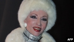 FILE - A 1990s photo shows late Lebanese singer Sabah arriving at an official function in a desingner winter outfit in Beirut.