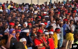 Angry protesters gather near the scene of Saturday's massive truck bomb attack, near the presidential palace, in Mogadishu, Somalia, Oct. 15, 2017.