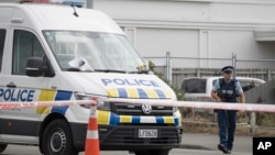 A police officer stands guard outside the Linwood mosque in Christchurch, New Zealand, March 19, 2019.