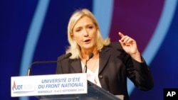 FILE - Leader of France's far-right National Front party Marine Le Pen is seen delivering a speech in Marseille, France, Sep. 6, 2015. Le Pen has admitted her party received an $11-million loan from a Russian-owned bank.