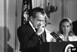 FILE - Richard Nixon says farewell to his Cabinet, aides, and staff on August 9, 1974.